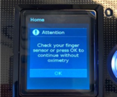 Sk&aelig;rm med teksten "Attention. Check your finger sensor or press OK to continue without oximetry"