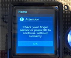 Skærm med teksten "Attention. Check your finger sensor or press OK to continue without oximetry"